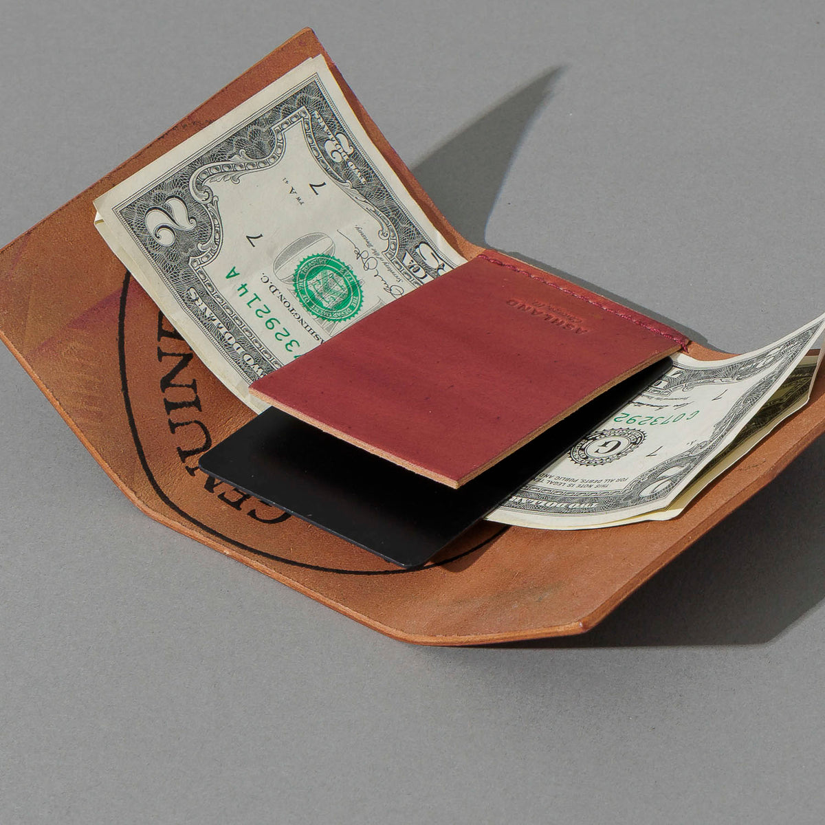 One-Off Jr. Fold in Marbled Ultraviolet Shell Cordovan, open with cash and cards, shot 2