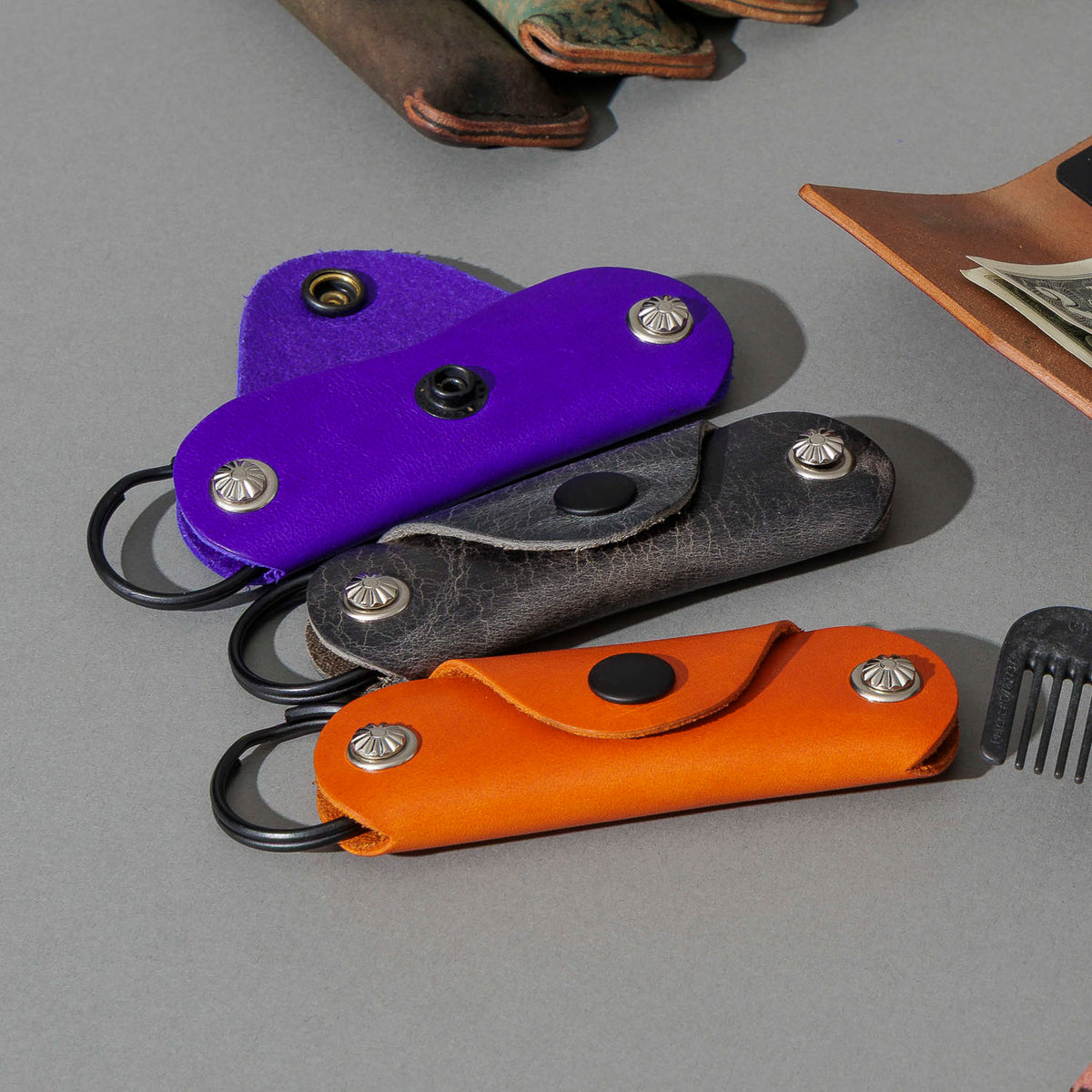 Vault Key Holder in Violet Latigo, group shot with other Fall Limited Release pieces