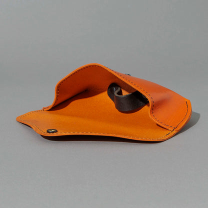 Glasses Case in Orange Latigo, open with sunglasses inside