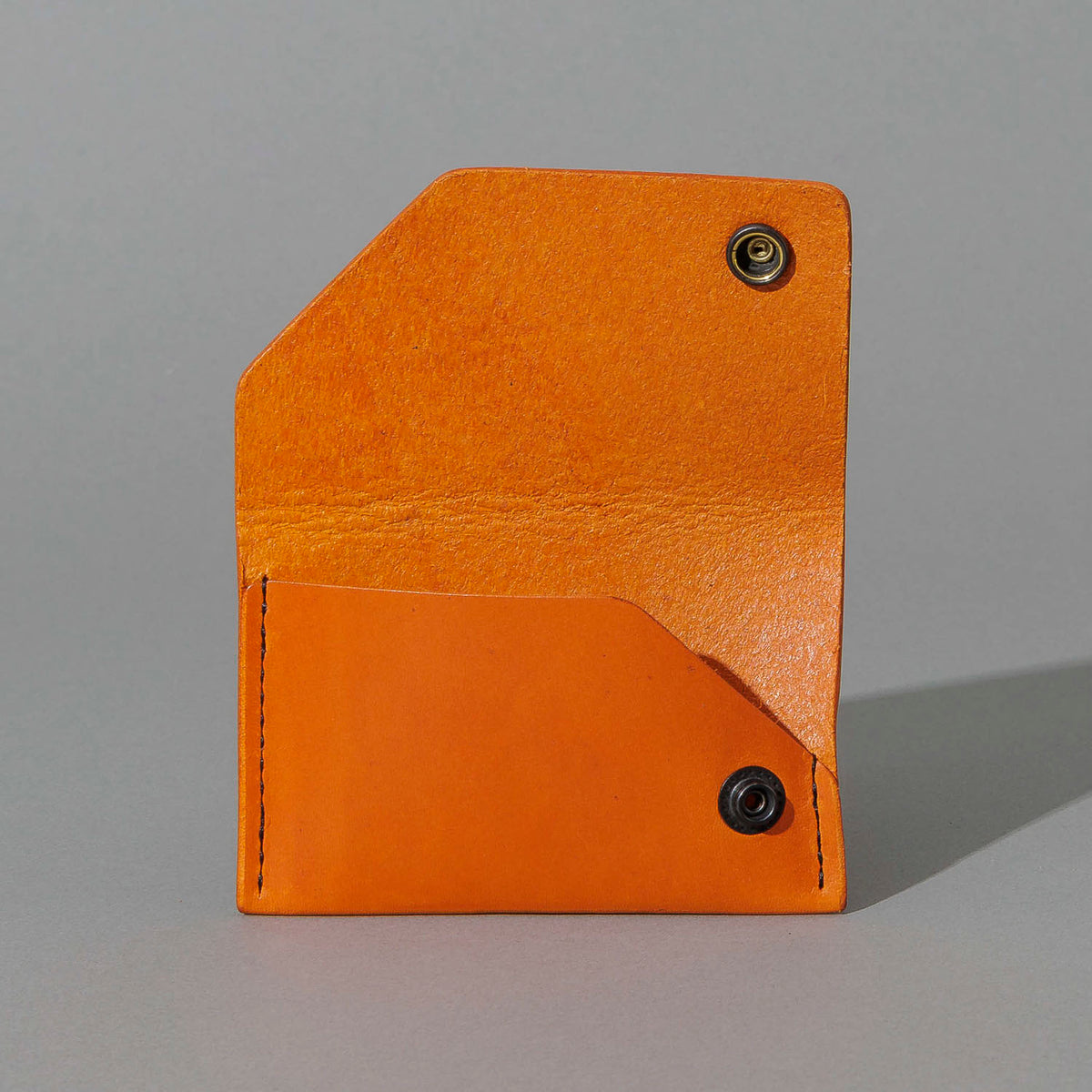 Machine Gun Jack in Orange Latigo, with flap open