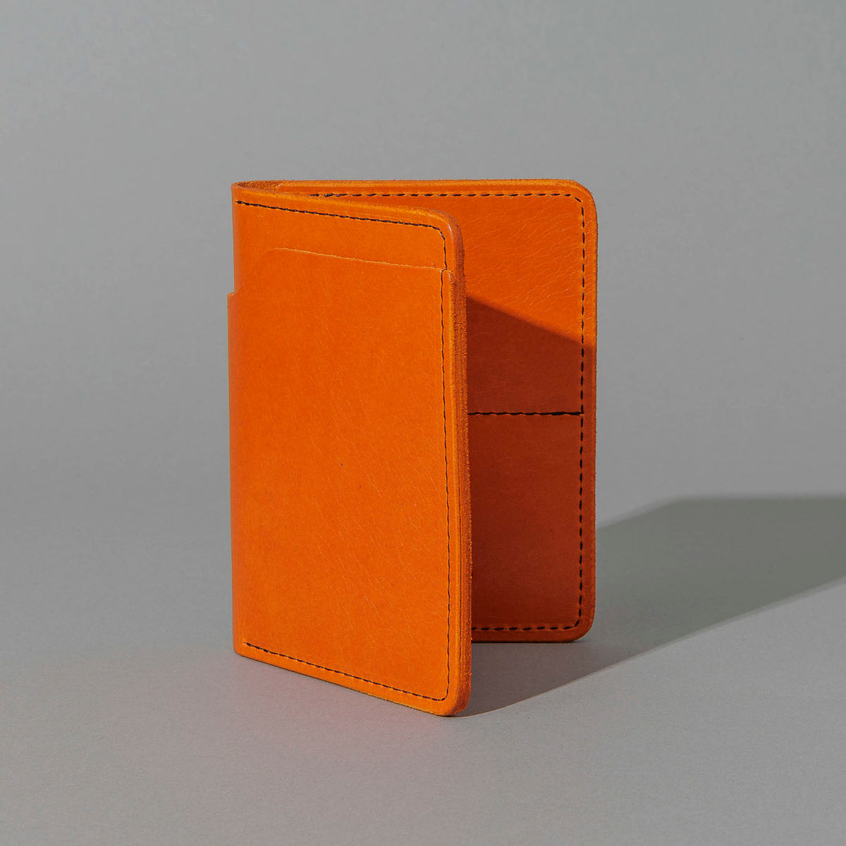 Fat Herbie in Orange Latigo, standing upright, side angle