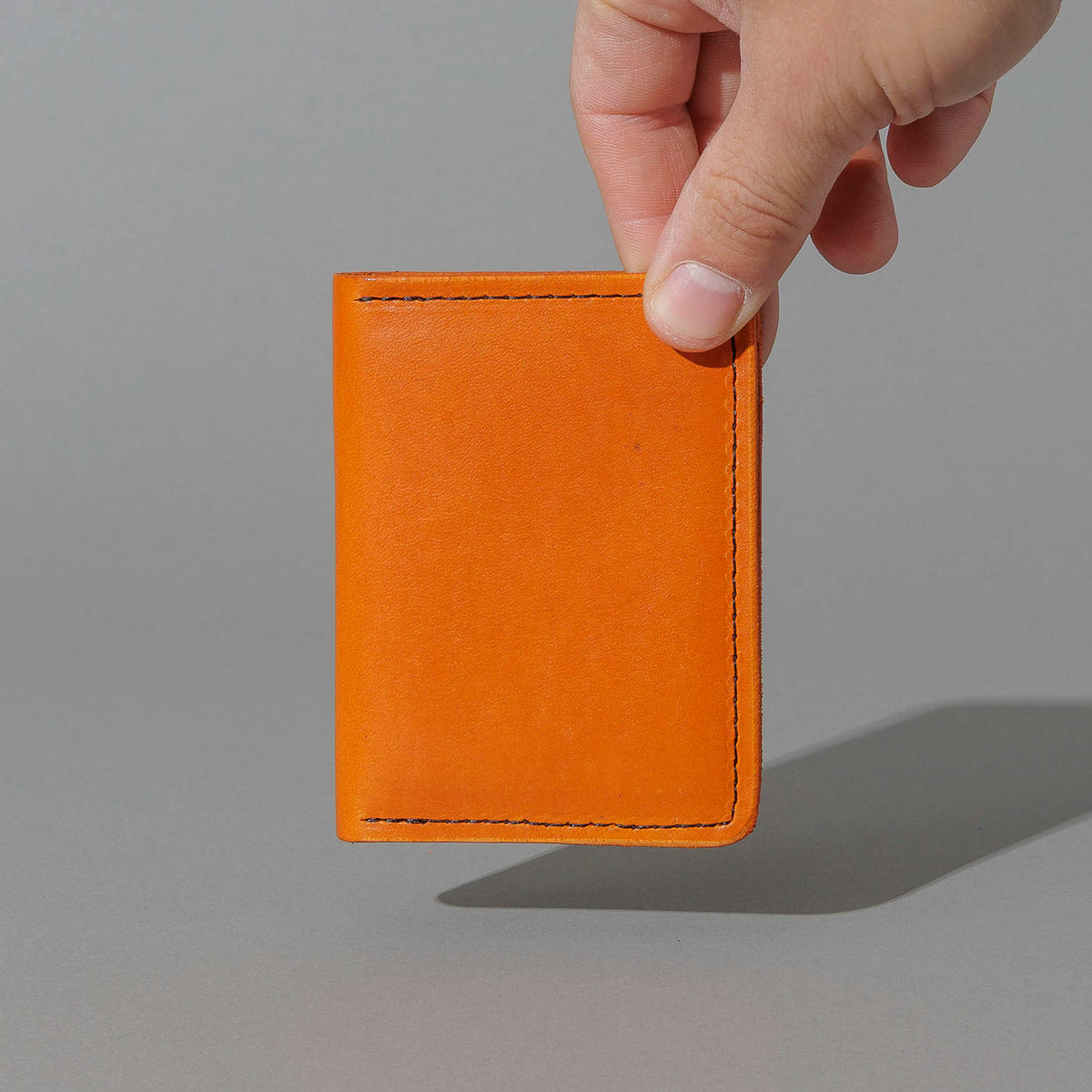 Vertical Bugs Moran in Orange Latigo, held in hand, shot 1