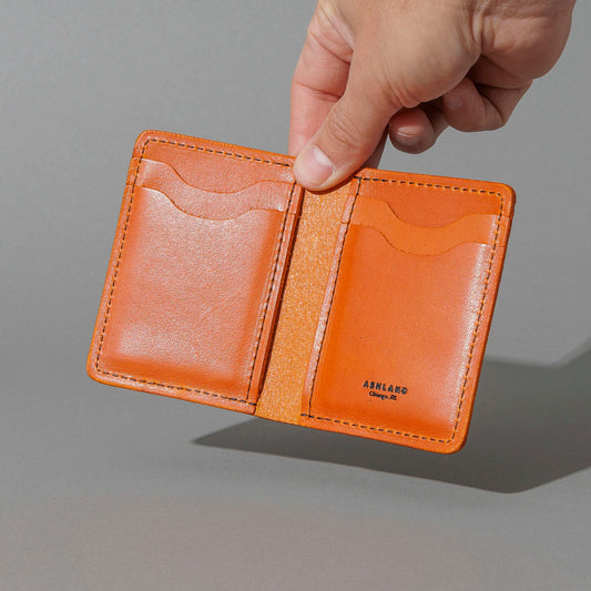 Vertical Bugs Moran in Orange Latigo, held open in hand, shot 1