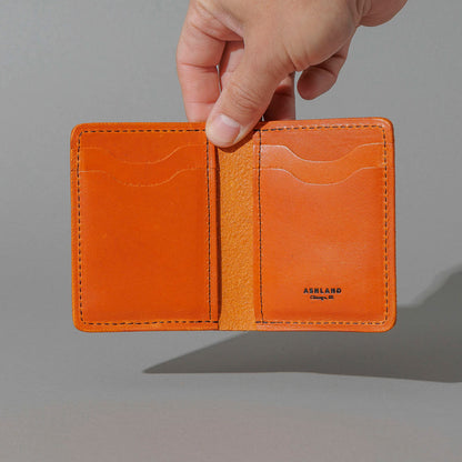 Vertical Bugs Moran in Orange Latigo, held open in hand, shot 2