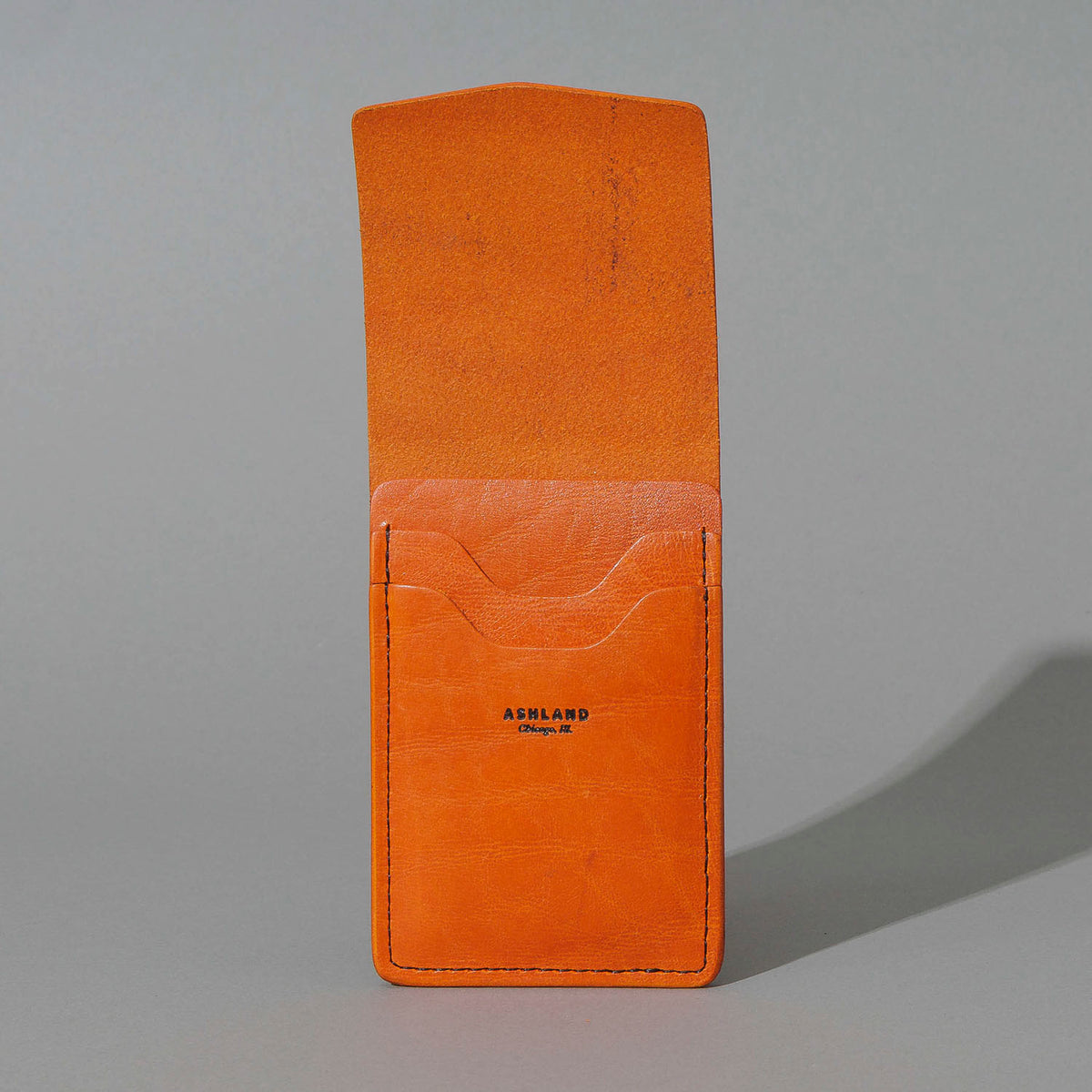 One-Off Lucky Wallet in Epic Orange Latigo, with flap open