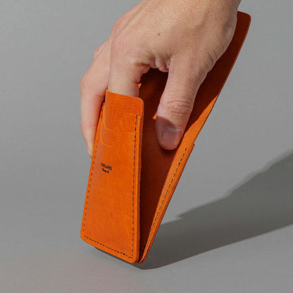 One-Off Lucky Wallet in Epic Orange Latigo, held in hand, shot 2