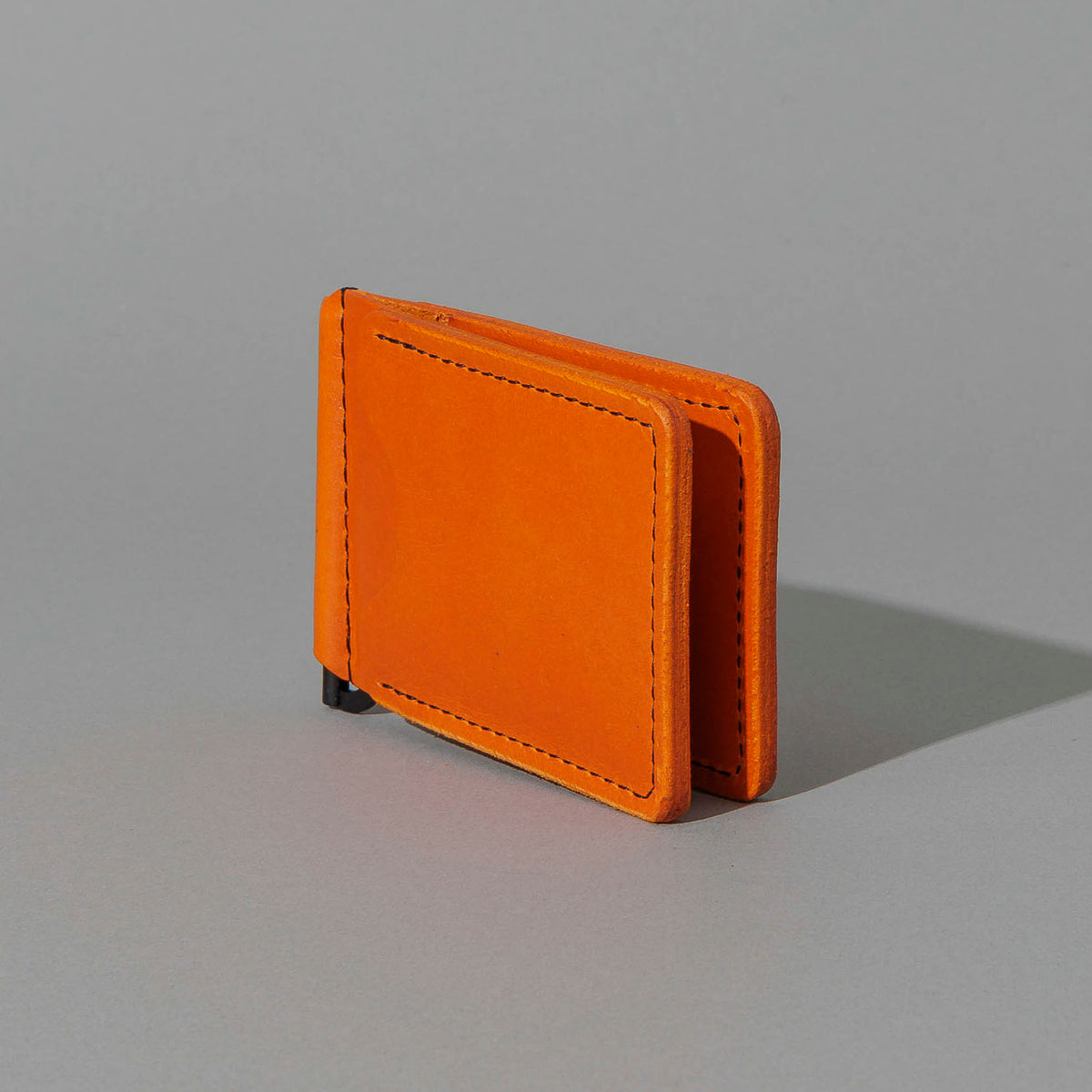 Capone Money Clip in Orange Latigo, standing upright, side angle