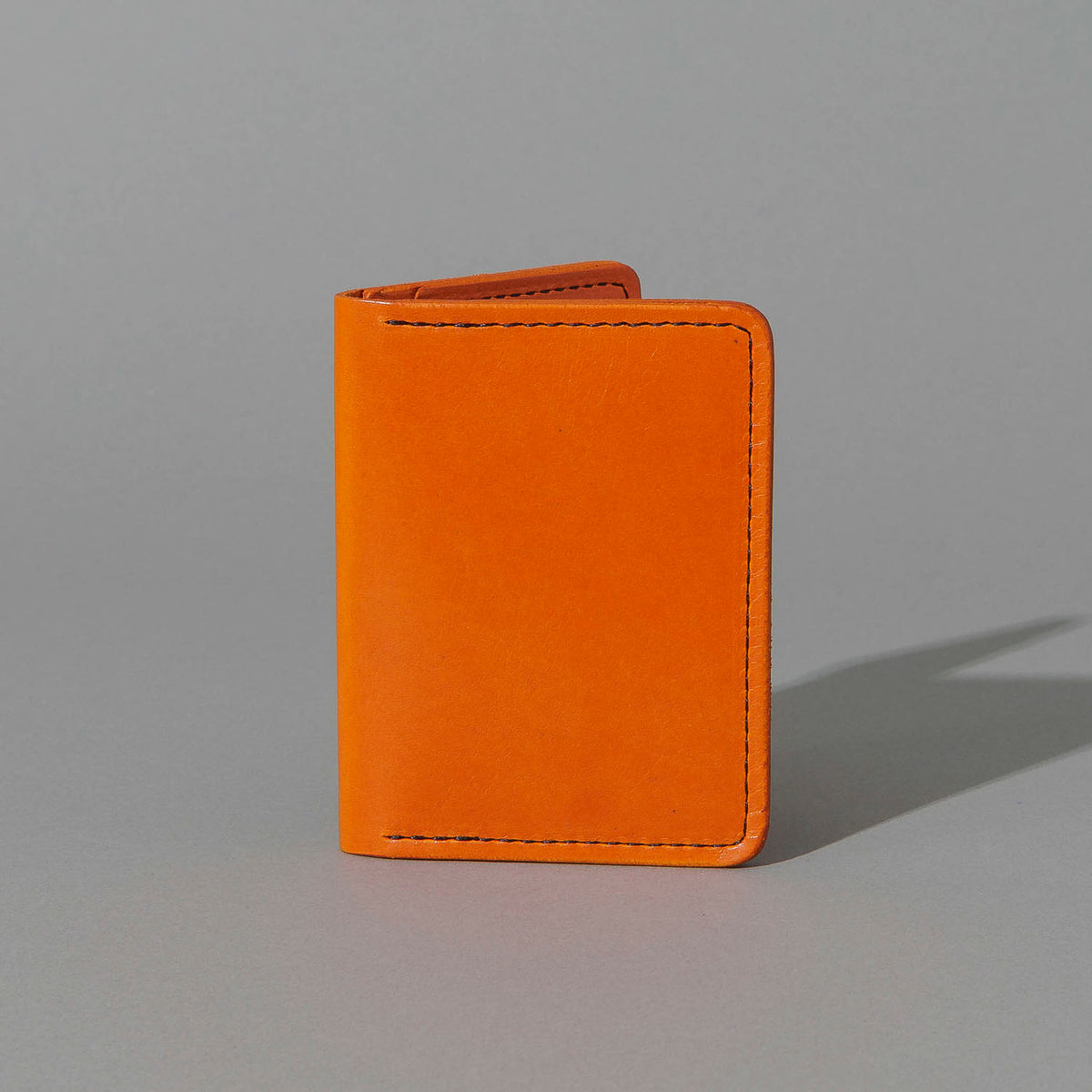 One-Off Six-Slot Bugs Moran Prototype in Orange Latigo, No Skip Stitch, standing upright, side angle, shot 1