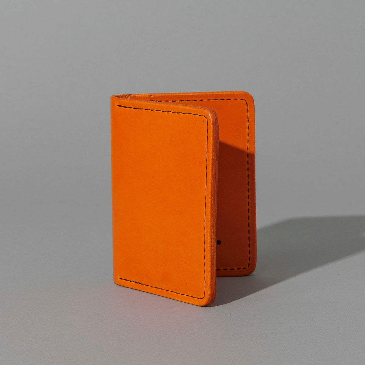 One-Off Six-Slot Bugs Moran Prototype in Orange Latigo, No Skip Stitch, standing upright, side angle, shot 2