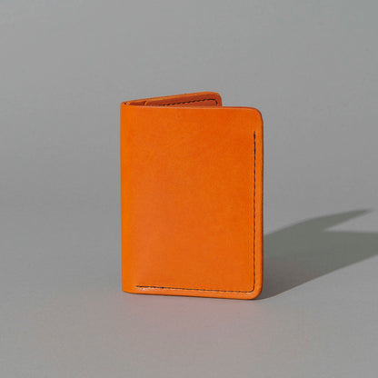 One-Off Six-Slot Bugs Moran Prototype in Orange Latigo, Skip Stitch, standing upright, side angle