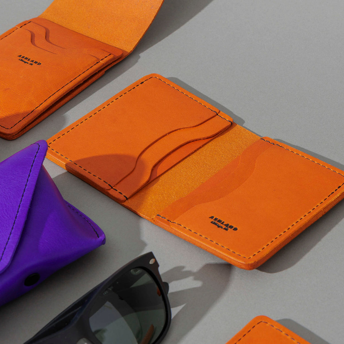One-Off Six-Slot Bugs Moran Prototype in Orange Latigo, Skip Stitch, group shot with other Fall Limited Release pieces
