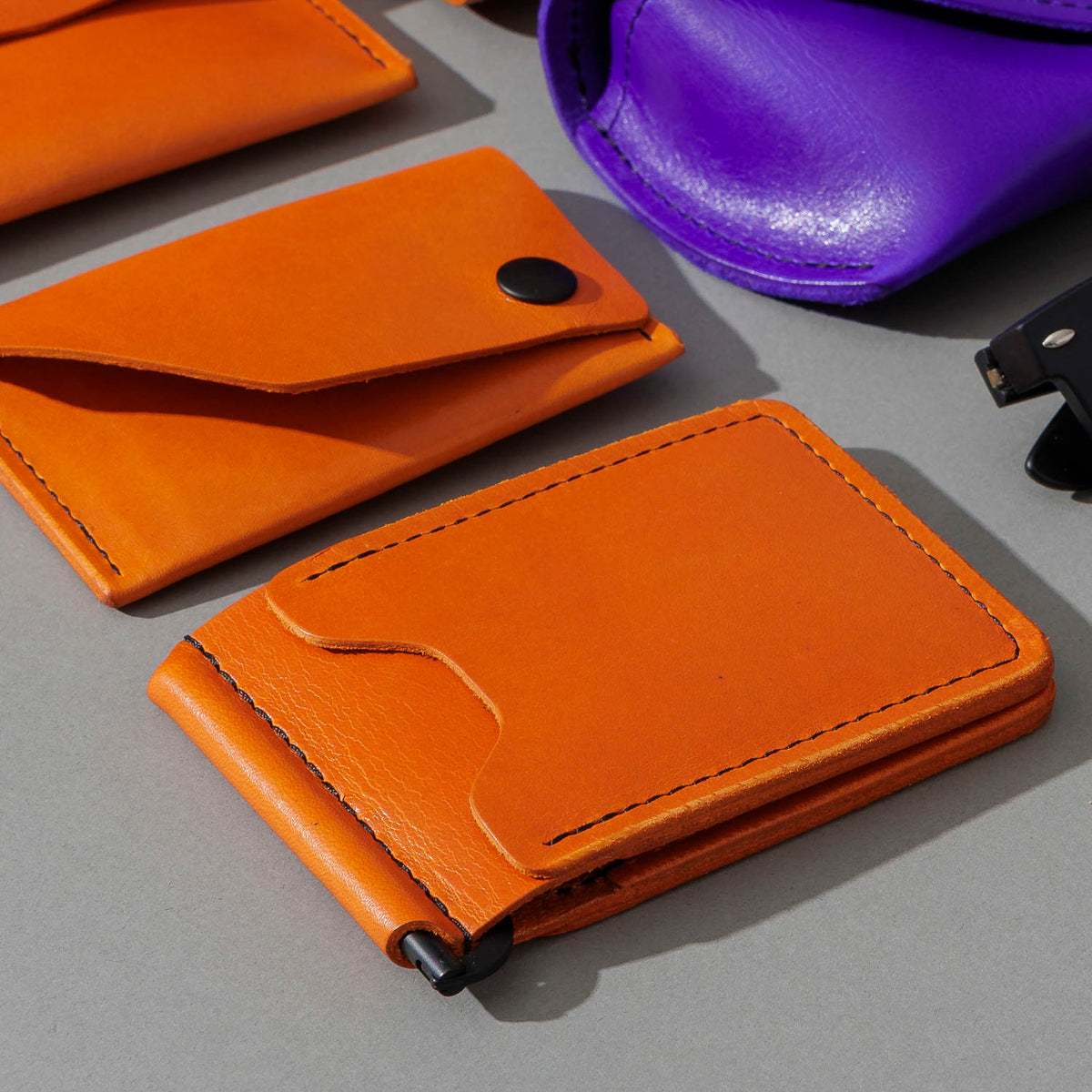 Capone Money Clip in Orange Latigo, group shot with other Fall Limited Release pieces