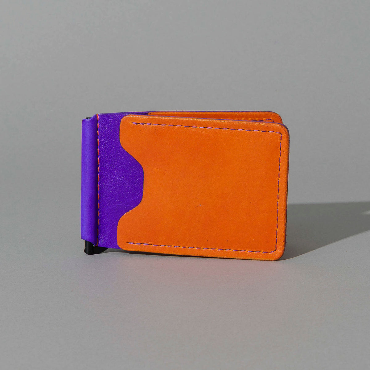 One-Off Capone Money Clip in Orange on Violet Latigo, front view
