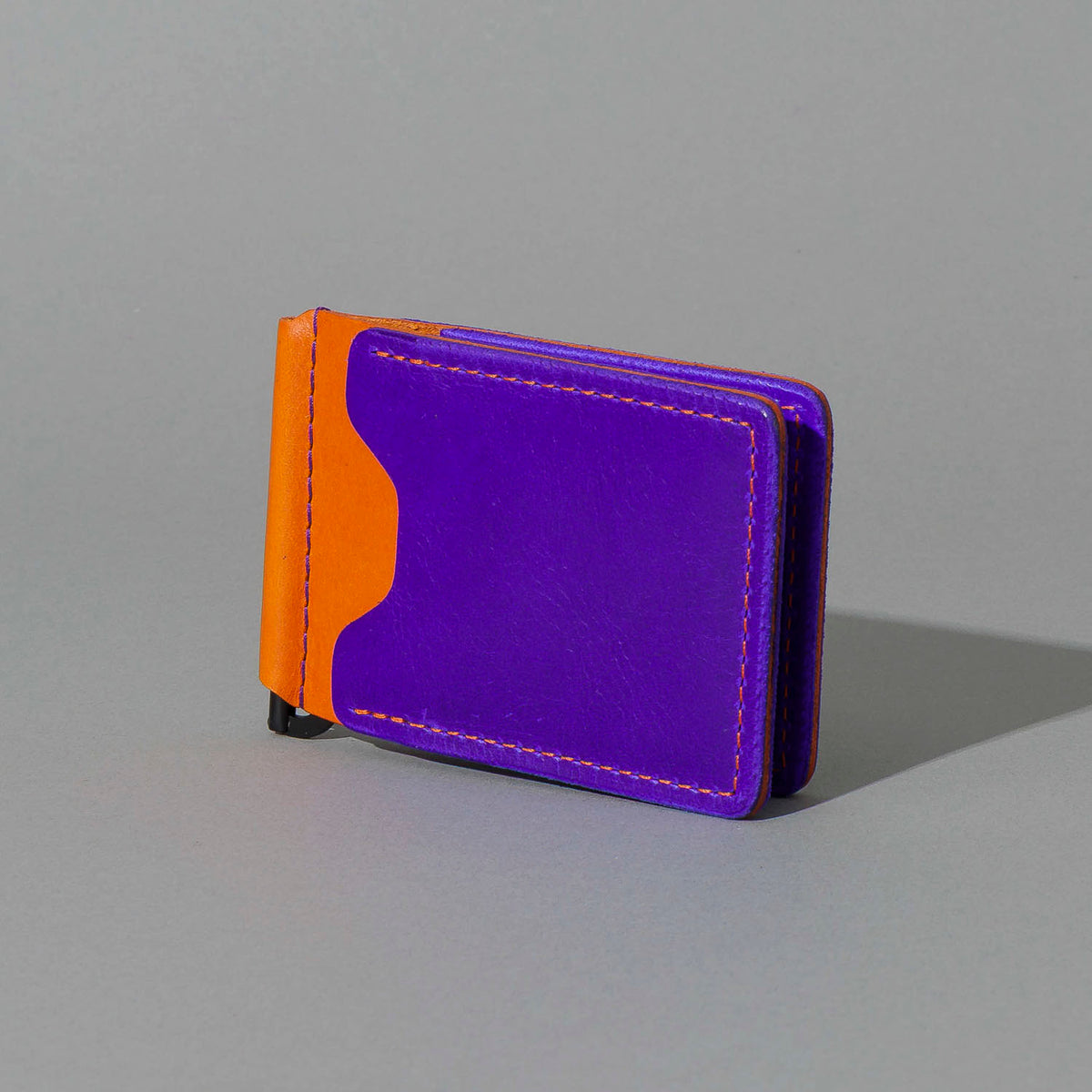 One-Off Capone Money Clip in Violet on Orange Latigo, front view, shot 2