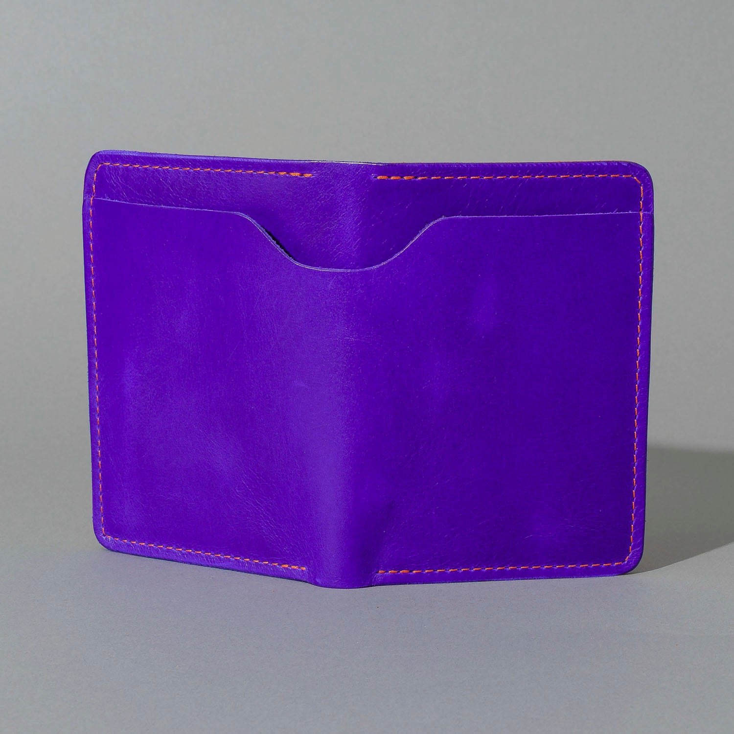 Traveler Passport Holder in Violet Latigo Exterior, Orange Latigo Interior, front view