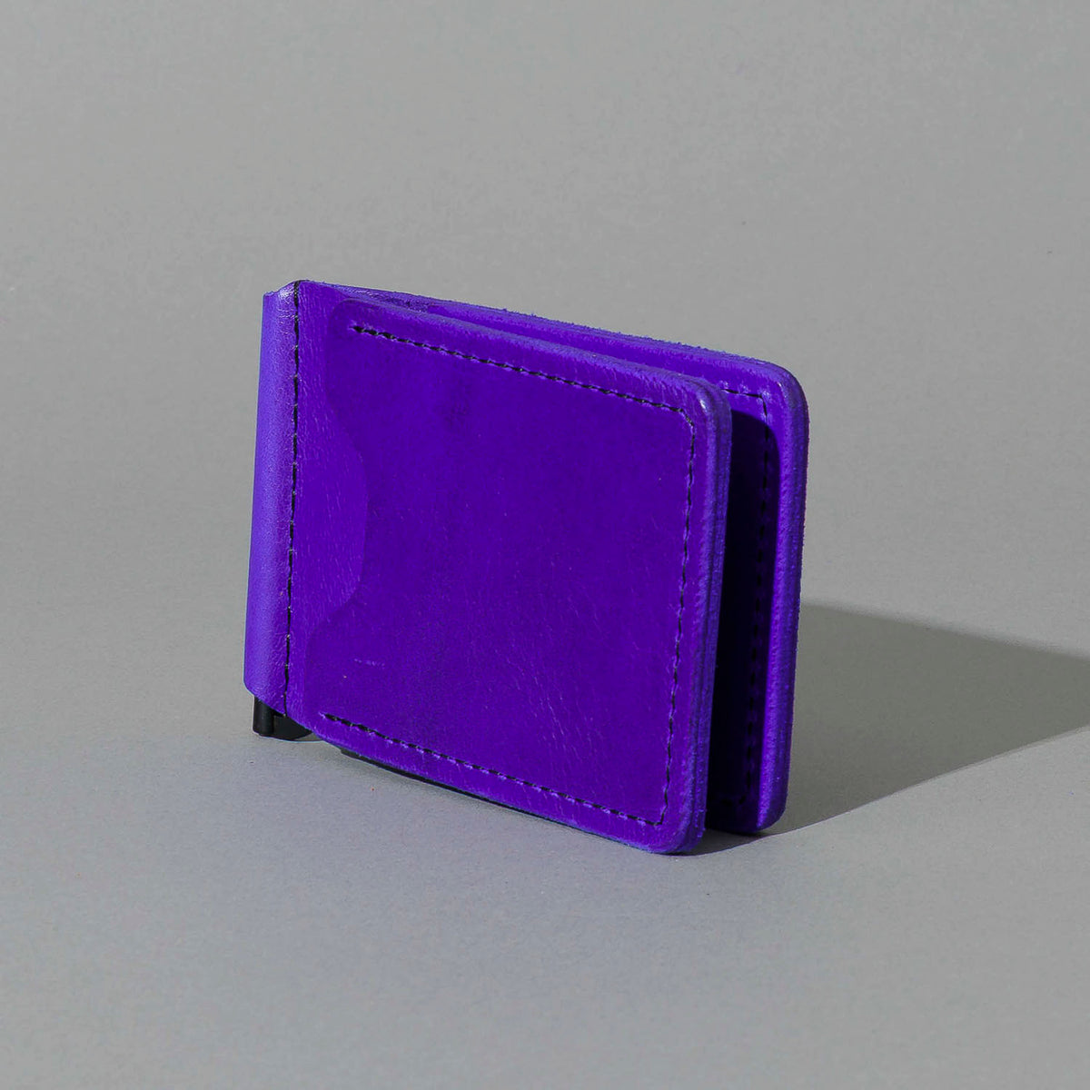 Capone Money Clip in Violet Latigo, standing upright, side angle