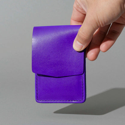 Lucky Wallet in Violet Latigo, held in hand, shot 1