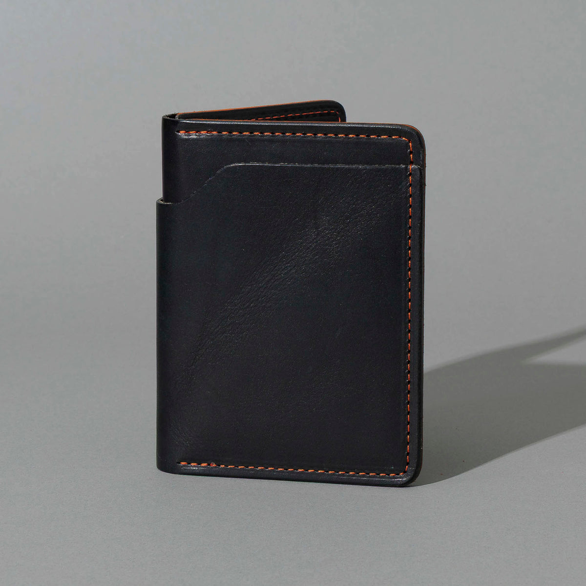 One-Off Fat Herbie in Black Dublin with Orange Accents, Two Hidden Card Slots, front view