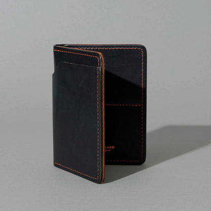 One-Off Fat Herbie in Black Dublin with Orange Accents, Two Hidden Card Slots, standing upright, side angle