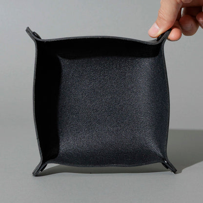 Valet Tray in Blacked Out Black Chromexcel®, assembled tray, held open by hand