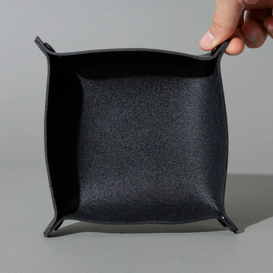 Valet Tray in Blacked Out Black Chromexcel®, assembled tray, held open by hand