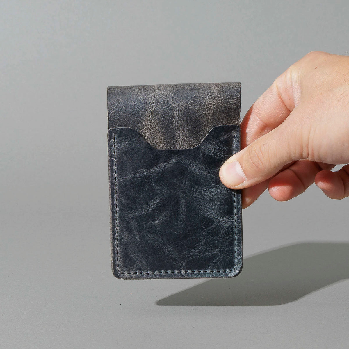 Lucky Wallet in Slate Vintage, held in hand, shot 2