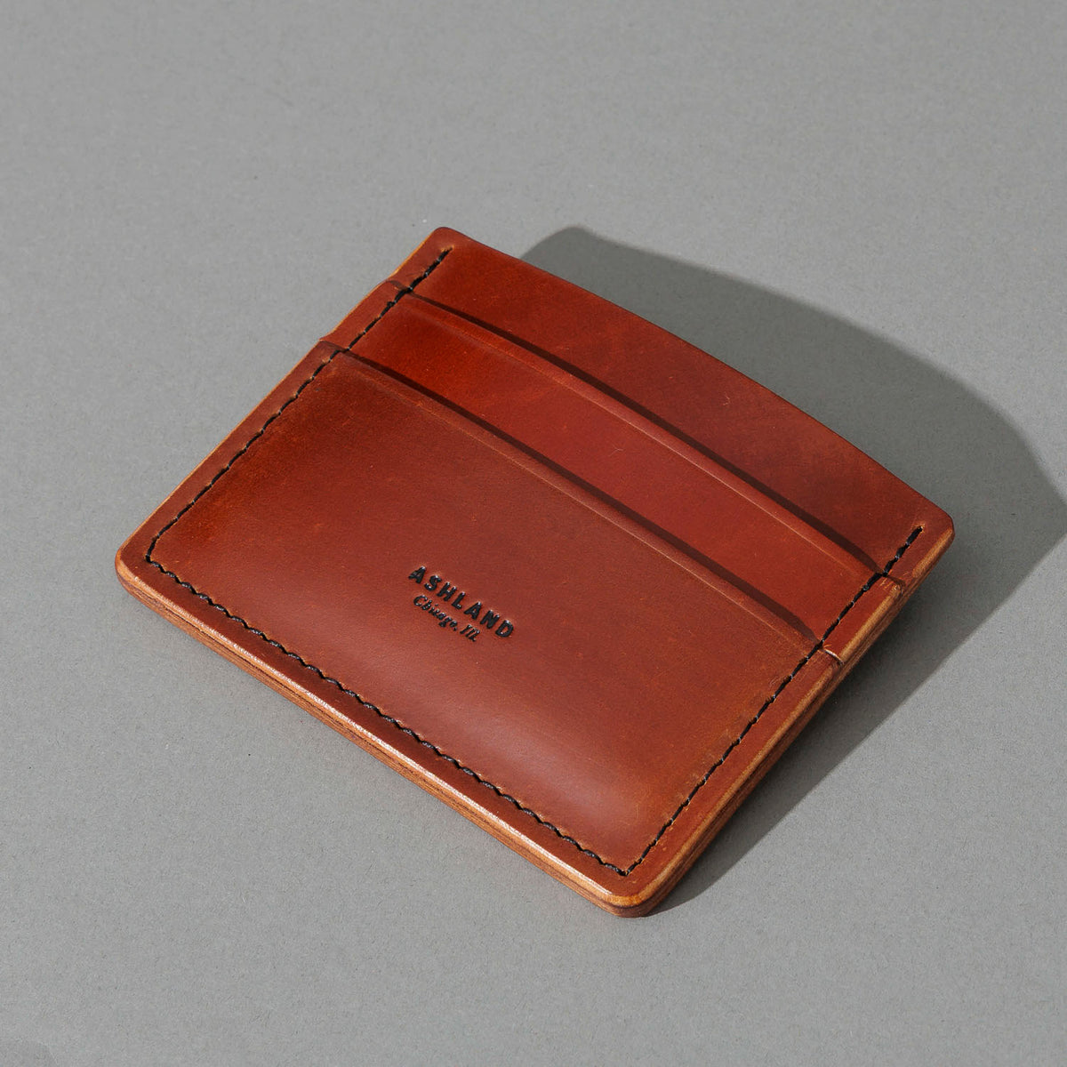 One-Off 5-Slot Frank the Enforcer in Blood Orange Shell Cordovan, angled view lying flat, shot 2