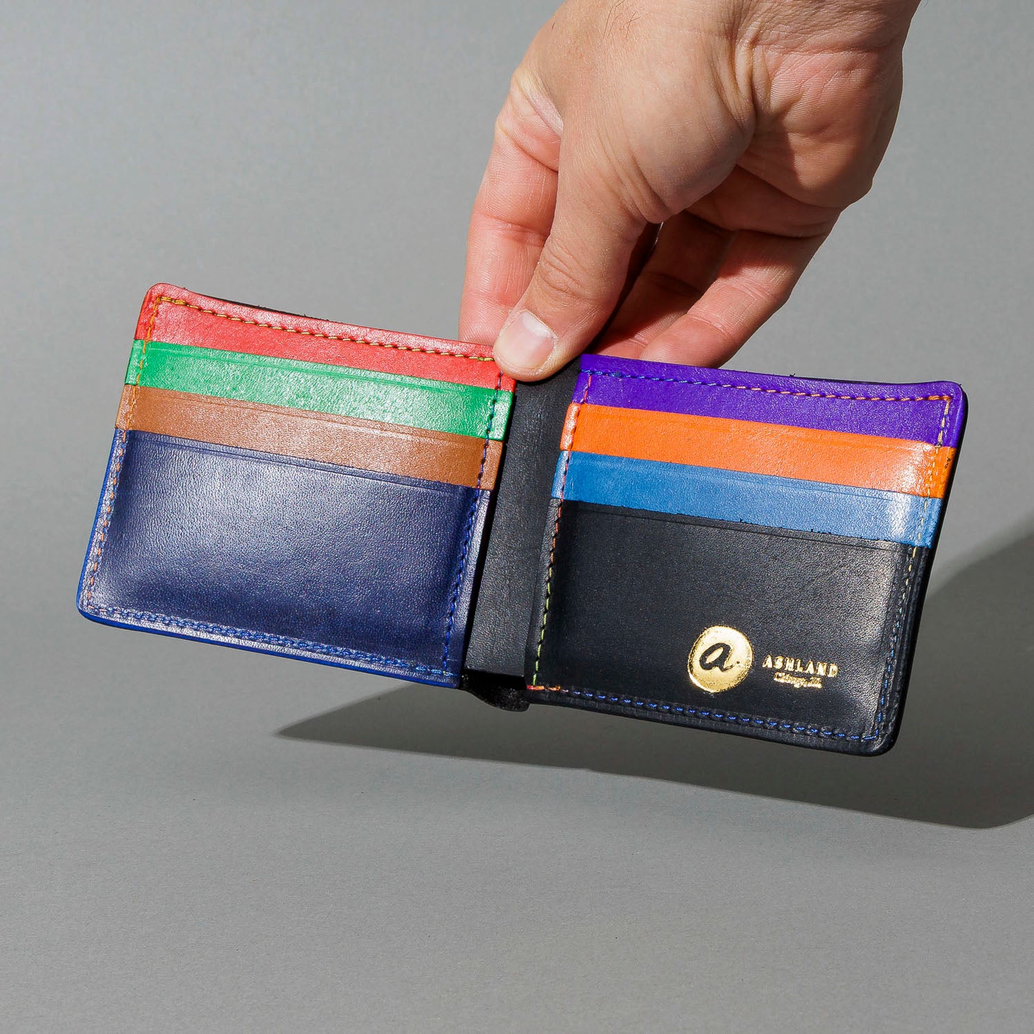 Johnny the Fox in Black Dublin with Multicolor Interior, held open in hand, shot 1