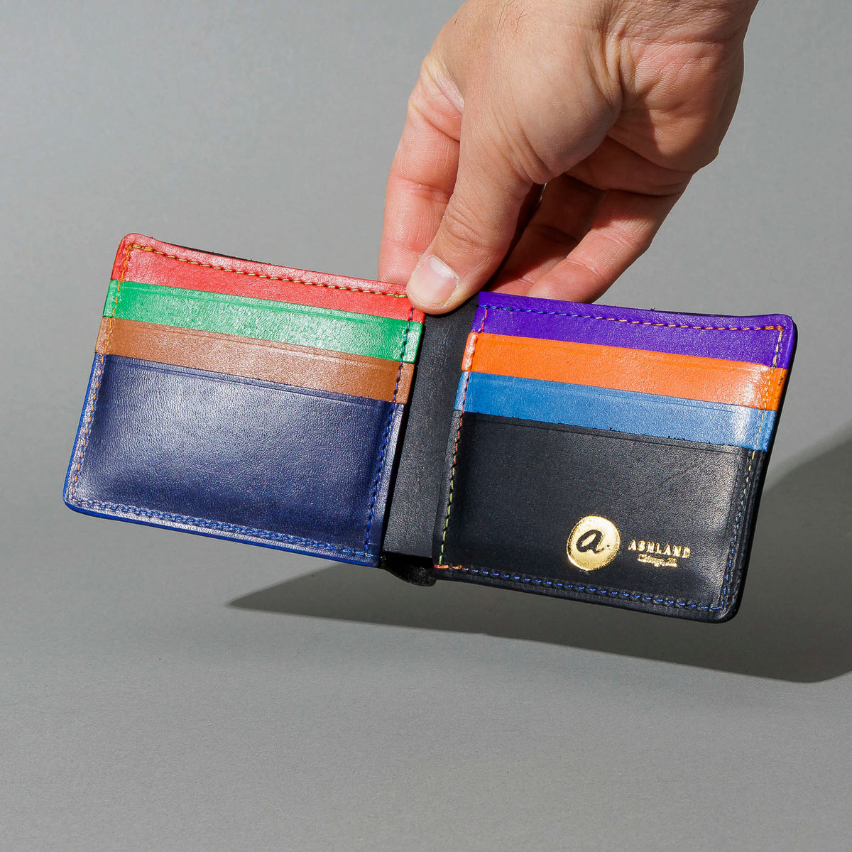 Johnny the Fox in Black Dublin with Multicolor Interior, held open in hand, shot 1