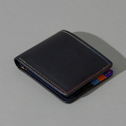 Johnny the Fox in Black Dublin with Multicolor Interior, angled view lying flat