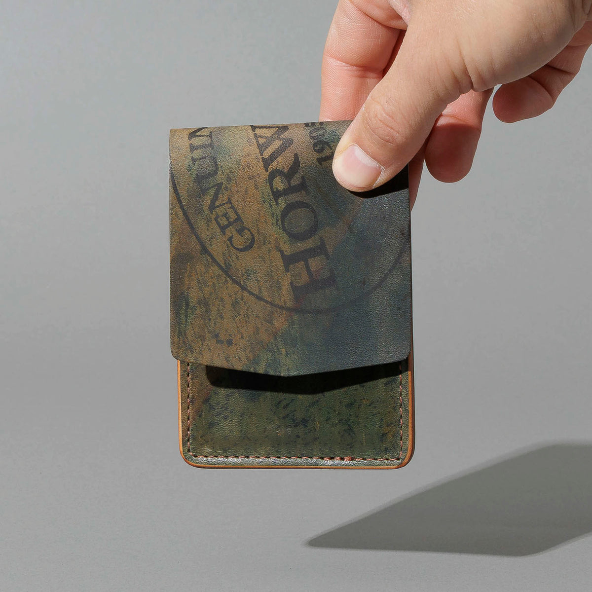 One-Off Lucky Wallet in Hand-Glazed Reverse Green Shell Cordovan, held in hand, shot 3