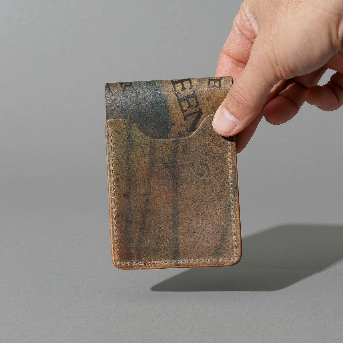 One-Off Lucky Wallet in Hand-Glazed Reverse Green Shell Cordovan, held in hand, shot 4