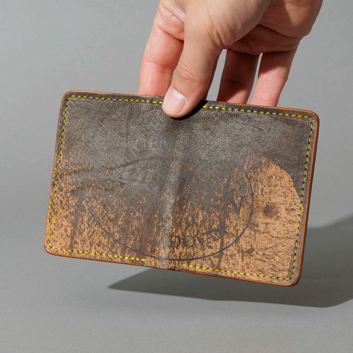 One-Off Bugs Moran in Epic Splatter Reverse Cigar Shell Cordovan, Yellow Thread, held in hand