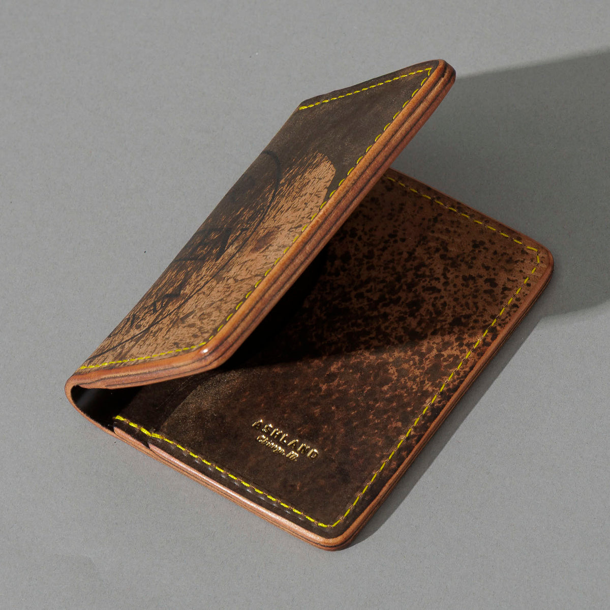 One-Off Bugs Moran in Epic Splatter Reverse Cigar Shell Cordovan, Yellow Thread, angled view lying flat, shot 1