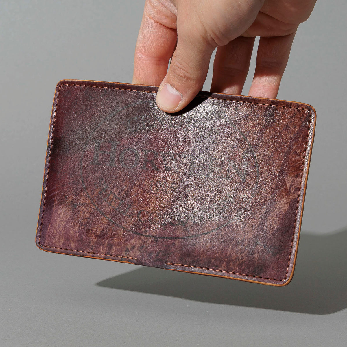 One-Off Vertical Bugs Moran in Hand-Glazed Reverse Color 8 Shell Cordovan, held in hand, shot 1