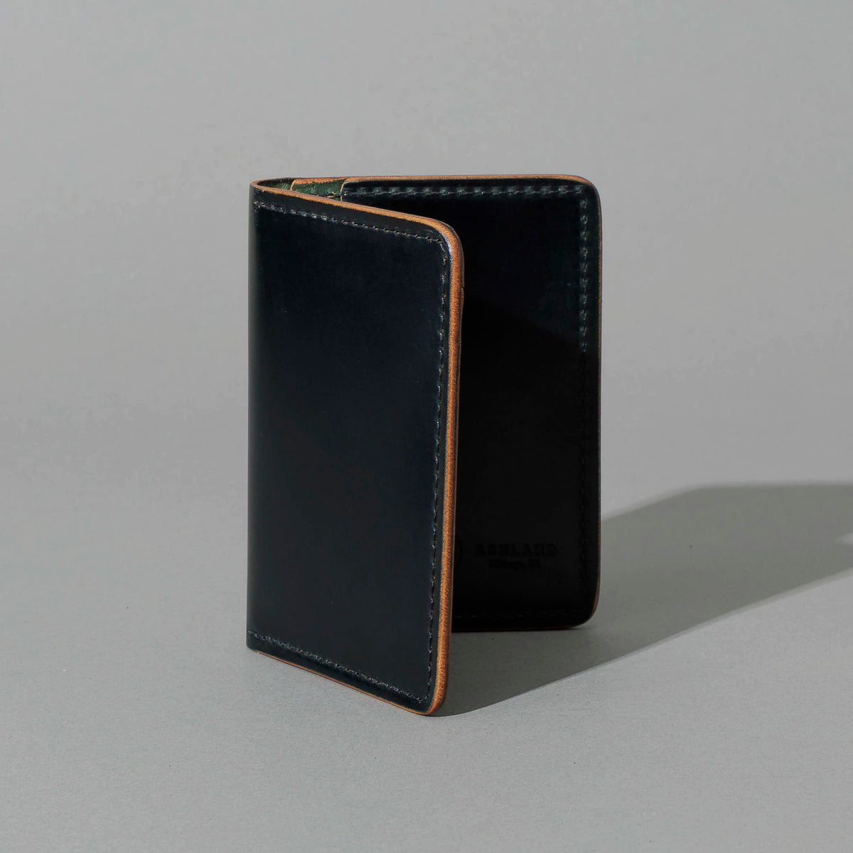 One-Off 50/50 Bugs Moran in Black and Reverse Shell Cordovan, standing upright, side angle