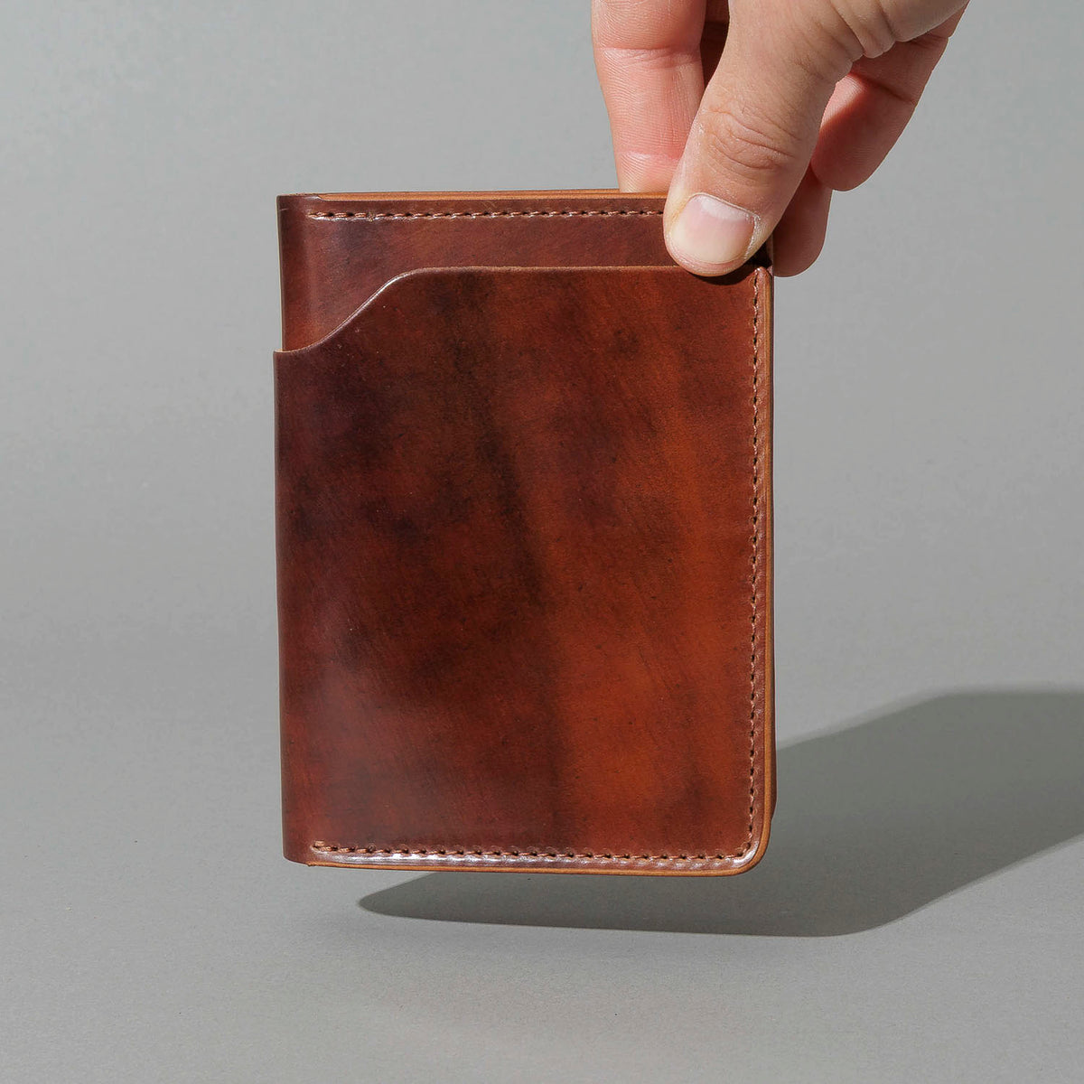 One-Off Fat Herbie in Marbled Color 8 Shell Cordovan with Reverse Interior, held in hand