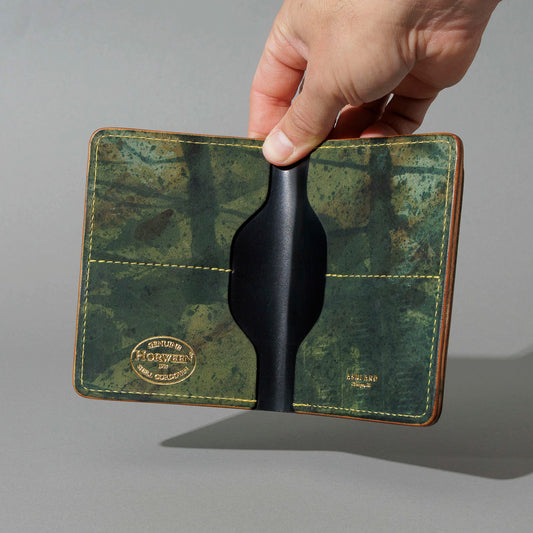 One-Off Fat Herbie in Epic Reverse Green Shell Cordovan, Gold Details, held open in hand, shot 1