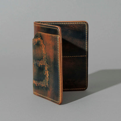 One-Off Fat Herbie in Branded Marbled Black Shell Cordovan, standing upright, side angle