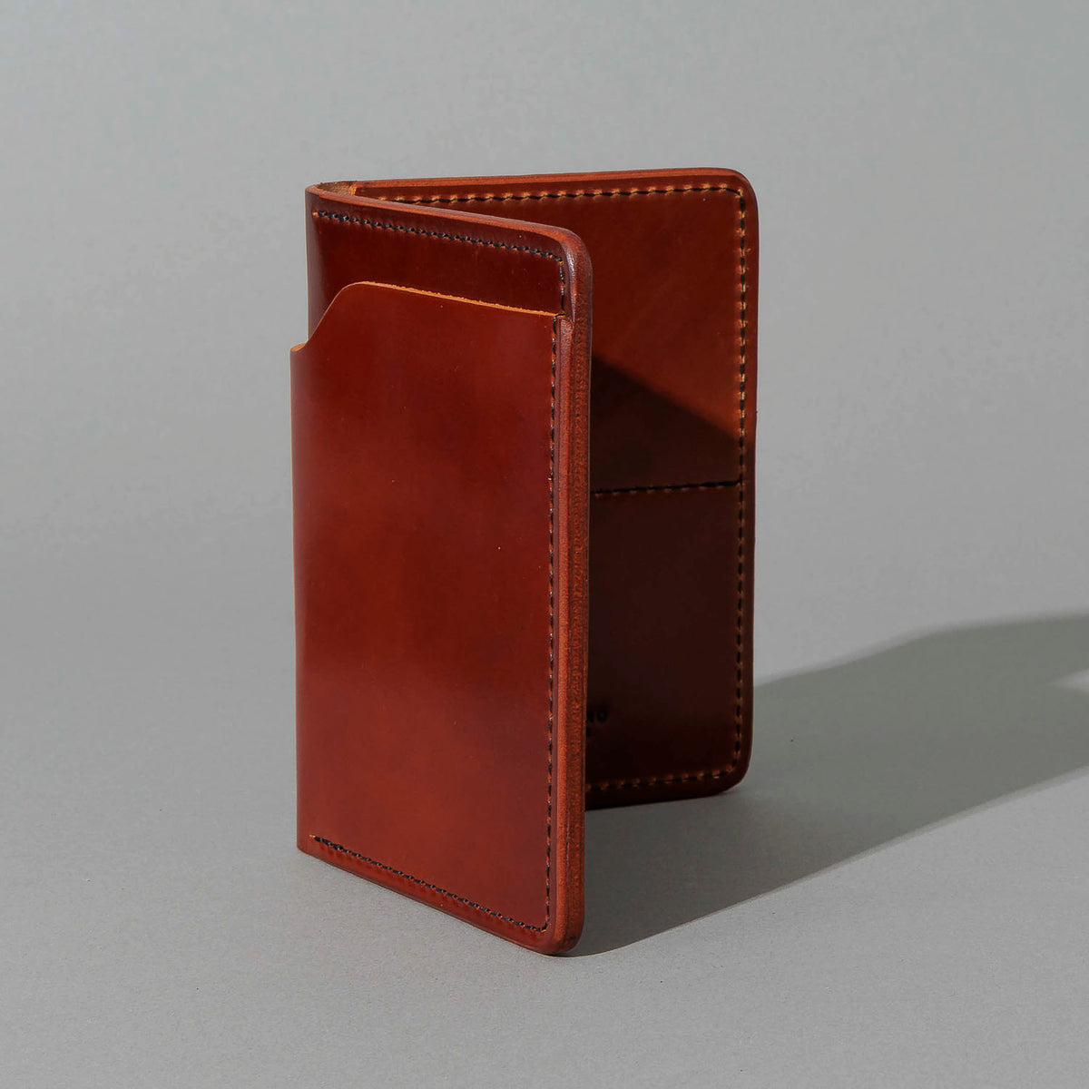 Fat Herbie in Garnet Shell Cordovan, Black Details, standing upright, side angle