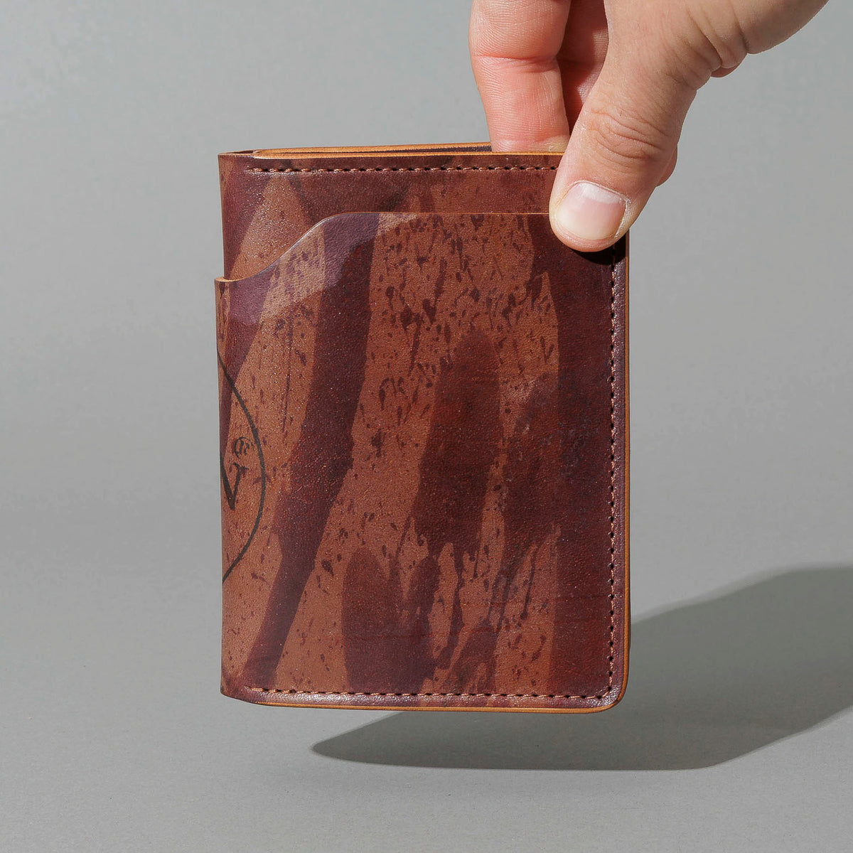 One-Off Fat Herbie in Hand-Glazed Epic Splatter Reverse Color 8 Shell Cordovan, held in hand