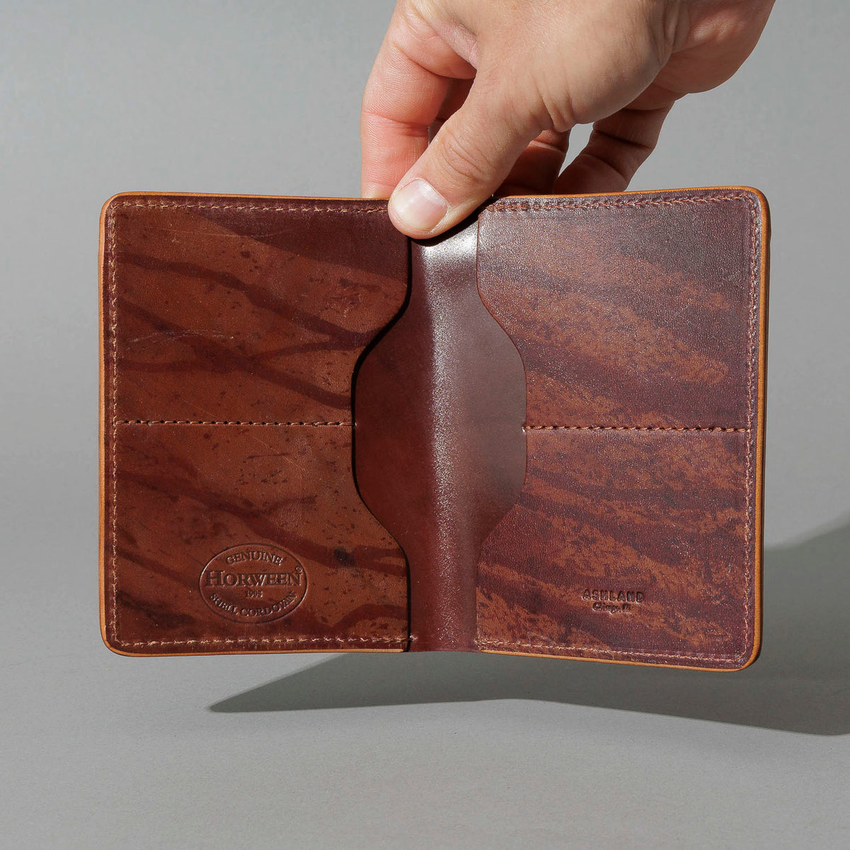 One-Off Fat Herbie in Hand-Glazed Epic Splatter Reverse Color 8 Shell Cordovan, held open in hand, shot 1