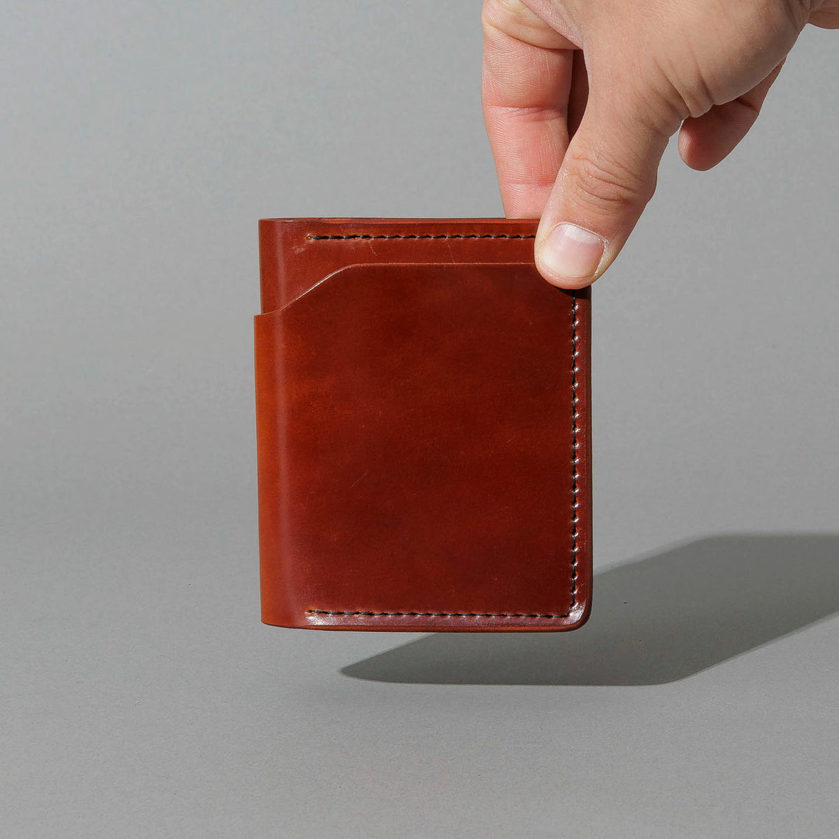 One-Off Tony the Ant in Garnet Shell Cordovan, held in hand, shot 1