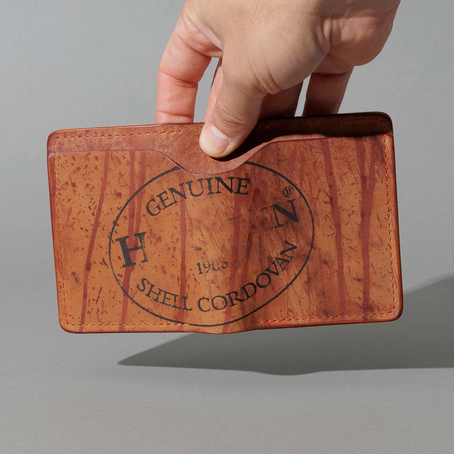 One-Off Tony the Ant in Epic Splatter Reverse Color 8 Shell Cordovan, held open in hand, shot 2