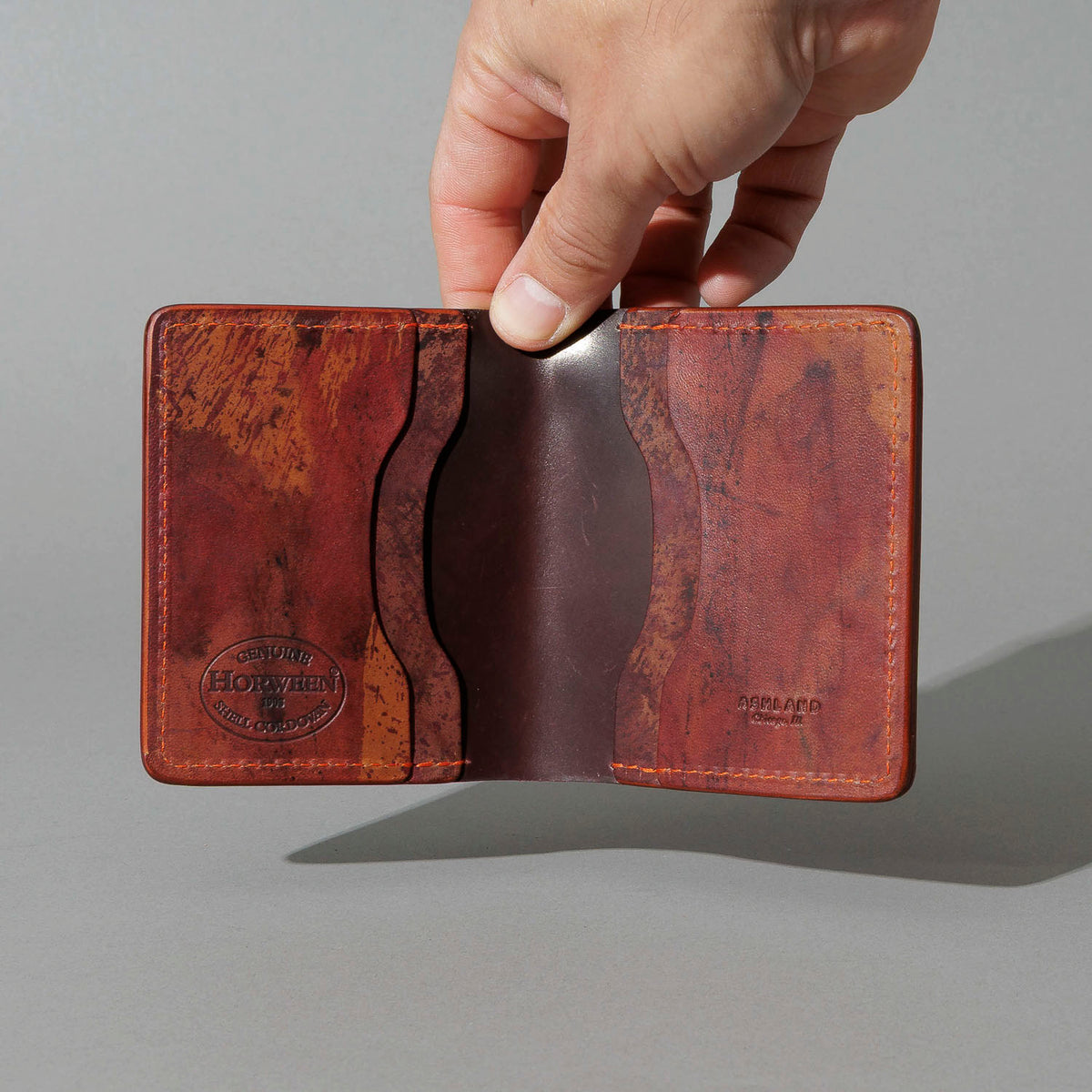 One-Off Tony the Ant in Epic Splatter Reverse Color 8 Shell Cordovan, held open in hand, shot 1