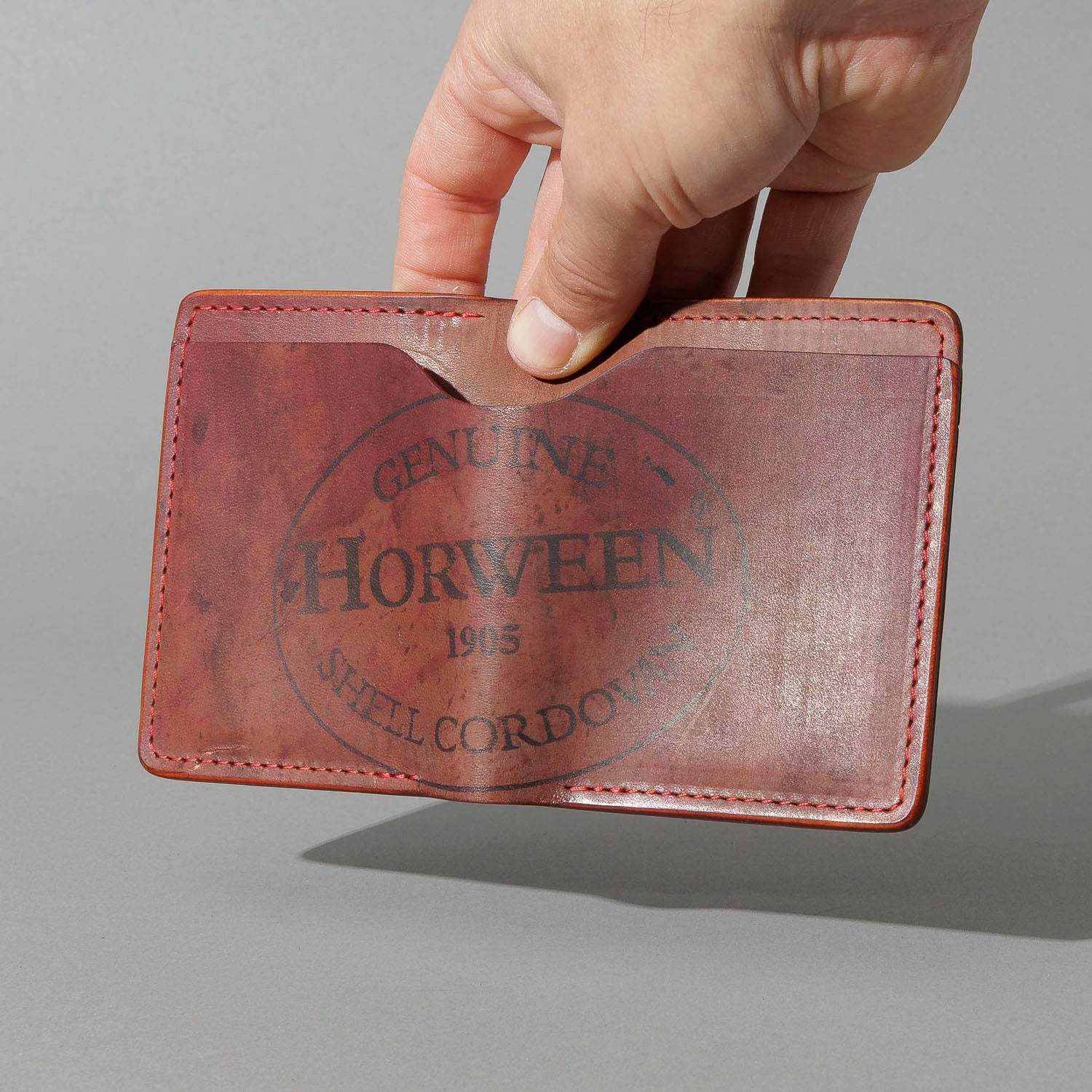 One-Off Vertical Tony the Ant in Hand-Glazed Reverse Color 8 Shell Cordovan, held open in hand, shot 2