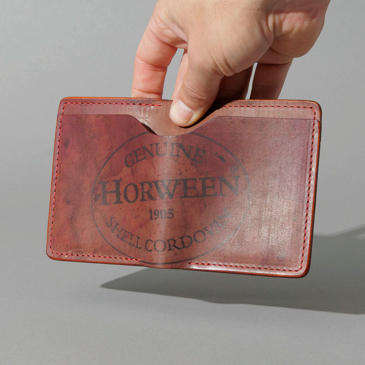 One-Off Vertical Tony the Ant in Hand-Glazed Reverse Color 8 Shell Cordovan, held open in hand, shot 2