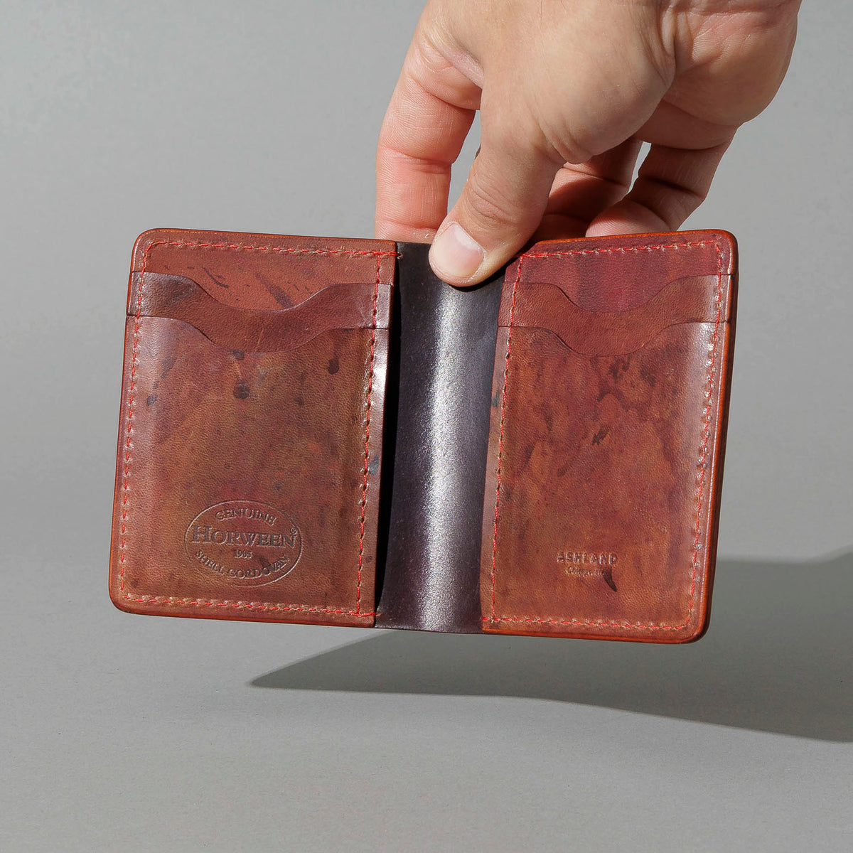 One-Off Vertical Tony the Ant in Hand-Glazed Reverse Color 8 Shell Cordovan, held open in hand, shot 1