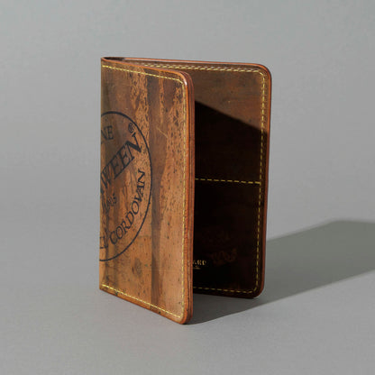 One-Off Traveler Passport Holder in Epic Splatter Reverse Cigar Shell Cordovan, No Bill Slot, standing upright, side angle