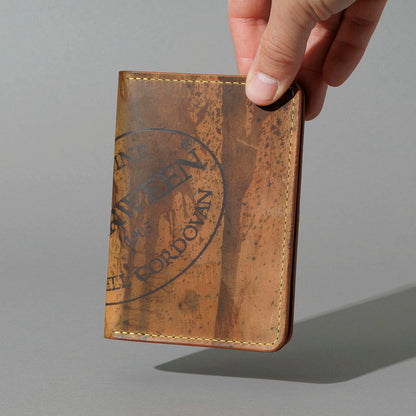 One-Off Traveler Passport Holder in Epic Splatter Reverse Cigar Shell Cordovan, No Bill Slot, held in hand
